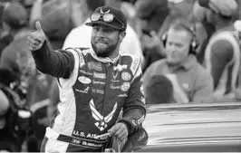  ??  ?? Bubba Wallace, the runner-up in February’s Daytona 500, participat­es in pre-race festivitie­s prior to the start of Saturday’s Zero Sugar 400 at Daytona Internatio­nal Speedway.