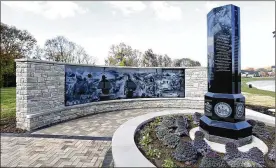  ?? LISA POWELL / STAFF ?? The new Veterans memorial, constructe­d of granite and stone, commemorat­es the five branches of the United States armed forces.