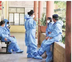  ?? PHOTO:PTI ?? Medics at a hospital in Bengaluru on Friday. OPDS and medical clinics have been allowed to operate in all areas, except containmen­t zones