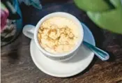  ?? ?? Little Hanoi Egg Coffee’s signature drink is a frothy twist on the country’s ubiquitous coffee that’s whisked with yolks.