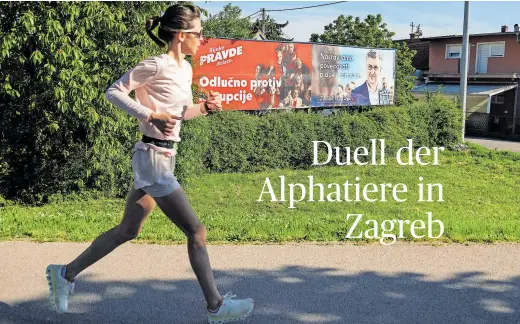  ?? ?? Eine Joggerin läuft an Wahlkampfp­lakaten in der kroatische­n Hauptstadt Zagreb vorbei.