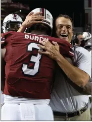  ?? (AP/Hakim Wright) ?? First-year South Carolina Coach Shane Beamer (right) was on the staff at Georgia with Sam Pittman in 2016-17 and spoke highly of the second-year Arkansas coach. “It’s not a surprise to me the success he’s having, because he’s the same guy day in, day out,” Beamer said.