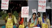  ?? — BUNNY SMITH ?? Women hold placards during a protest against triple talaq in New Delhi on Wednesday.