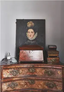  ??  ?? Paris, the elegant inlaid continenta­l commode (above right) makes an eye-catching dressing table. The French portrait of a nun strikes a serene note.
Walls in Manor House Gray, Farrow & Ball