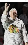  ?? (AP file photo) ?? Former Chicago Blackhawks star Bobby Hull, here waving to fans before a 2009 game in Chicago, died Monday at age 84.