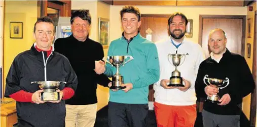  ??  ?? TROPHY TIME: From left, scratch runner-up Bruce Thomson (Inverness), Kevin Thomson (Moray, alliance captain), Jeff Wright (Forres), Bryan Fotheringh­am (Forres, scratch aggregate winner) and Ali Mackintosh (Inverness handicap aggregate winner)