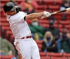  ?? MATT sTONE pHOTOs / HErAld sTAFF ?? ‘FEELING SEXY AT THE PLATE’: Christian Vazquez hits a two-run home run during the fourth inning against the Tampa Bay Rays at Fenway Park on Wednesday afternoon. Below, Sox starter Nathan Eovaldi throws during the first inning. At bottom, Christian Arroyo celebrates on second after his RBI double during the fifth inning.