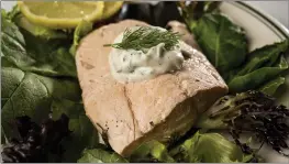  ?? PHOTOS BY COLTER PETERSON — ST. LOUIS POST-DISPATCH — TNS ?? Poached Salmon with a dill mayo sauce on a bed of greens, pictured on Wednesday.