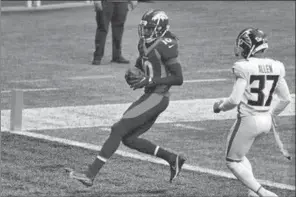  ?? BRYNN ANDERSON/AP ?? Denver Broncos wide receiver Jerry Jeudy, 10, runs into the end zone for a touchdown against Atlanta Falcons free safety Ricardo Allen, 37, during the second half of an NFL football game, Sunday, Nov. 8, 2020, in Atlanta.