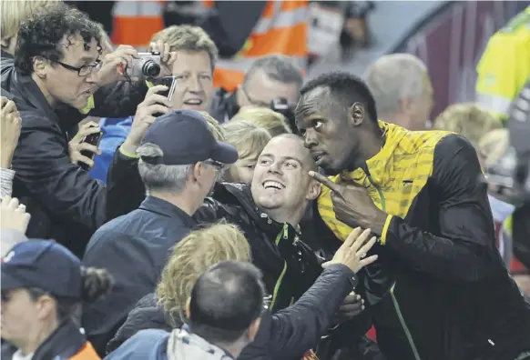  ?? PICTURE: ANDREW O’BRIEN ?? Usain Bolt posed for a Commonweal­th record number of selfies at the Glasgow Games of 2014 but the city has more urgent concerns than trying to repeat their success