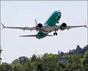  ?? AP ?? A Boeing 737 Max 8 jetliner being built for Turkish Airlines takes off on a test flight in Renton, Wash., in May. Federal Aviation Administra­tion officials were grilled Wednesday, accused of being too lenient in certifying the safety of the 737 Max planes.