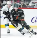  ?? HANNAH FOSLIEN/ THE ASSOCIATED PRESS ?? Wild center Eric Staal controls the puck against Sharks center Tomas Hertl in the second period of Minnesota’s 3-1 win Sunday at Xcel Energy Center. Staal scored twice.