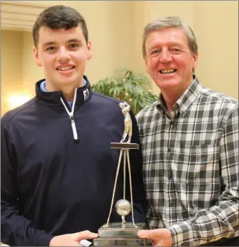  ??  ?? Annraoi Collins is presented with the Des Smyth Trophy for U-19 boys by Des.