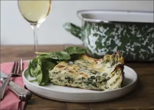  ?? SARAH CROWDER, THE ASSOCIATED PRESS ?? This is rich and creamy, absent the tomato sauce that anchors many lasagnas, filled with sautéed spinach folded into fluffy ricotta and a very simple béchamel sauce, rich with melty cheeses.