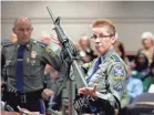  ??  ?? A Connecticu­t State Police detective in 2013 displayed a Bushmaster AR-15 rifle.
