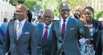  ?? Kopano Tlape, GCIS ?? The money men: Treasury directorge­neral Dondo Mogajane, Deputy Finance Minister Siphiso Buthelezi and Finance Minister Malusi Gigaba arrive at Parliament on Wednesday. /