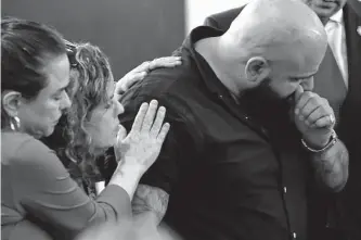  ?? Jerry Lara/staff photograph­er ?? Joey Cantu, brother of victim Guiselda Alicia Cantu Hernandez, is comforted during victim impact statements after Juan David Ortiz got life in prison for her murder and three others.