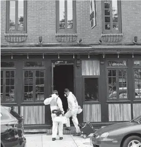  ?? LLOYD FOX/BALTIMORE SUN ?? Workers from the company Disinfect-It head to Cowboy Row in Canton Square last week. Several restaurant­s have temporaril­y closed because of recent COVID-19 outbreaks.