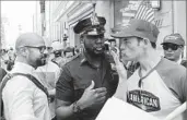  ?? Eduardo Munoz Alvarez Getty Images ?? A POLICE officer tries to separate pro- and antiTrump activists in New York on April 29.