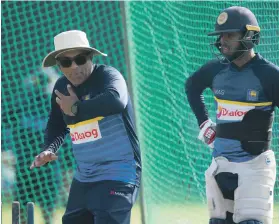  ?? Getty ?? Former Sri Lanka opening batsman Chandika Hathurusin­ghe, left, launched his coaching career when he took charge of the UAE cricket team in 2006