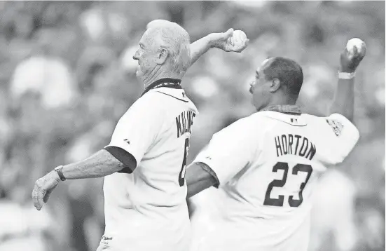  ?? AMY LEANG/DETROIT FREE PRESS ?? Tiger greats Al Kaline and WIllie Horton throw the ceremonial first pitches at Comerica Park in the All-Star Game on July 12, 2005. “I think about him all the time,” Horton says. “He’ll always be with me.”