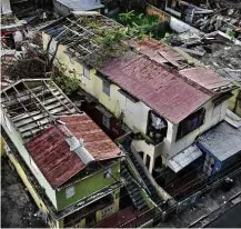  ?? Carlos Giusti - 15.nov.2017/Associated Press ?? Casas destruídas pelo furacão Maria na ilha de Porto Rico