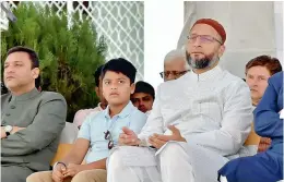  ?? STYLE ?? AIMIM president Asaduddin Owaisi during his party’s 62nd Foundation Day Ceremony in Hyderabad on Sunday. MIM floor leader Akbaruddin Owaisi (left) and the party chief’s son Sultan Salahuddin Owaisi (centre) could also be seen. —