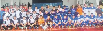  ??  ?? (Back row from ninth left), Alidin, Dr Rahman, Abdul Ajis and other LFA exco members pose with players of Tiger FC and ABC Club.