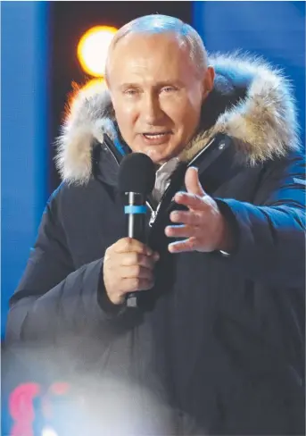  ?? Picture: AP PHOTO ?? FIRM GRIP: Vladimir Putin speaks to his jubilant supporters after the Russian president achieved a commanding electoral win.