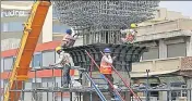  ?? REUTERS FILE ?? A glut of constructi­on workers seems to have facilitate­d a squeeze on wages across the sector.