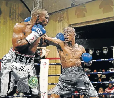  ?? Picture: MARK ANDREWS ?? THE HITS KEEP COMING: Mdantsane boxer Makazole Tete, seen here exchanging blows with Gideon Buthelezi in a previous fight at Orient Theatre, will take on Namibian Jonas Matheus next month