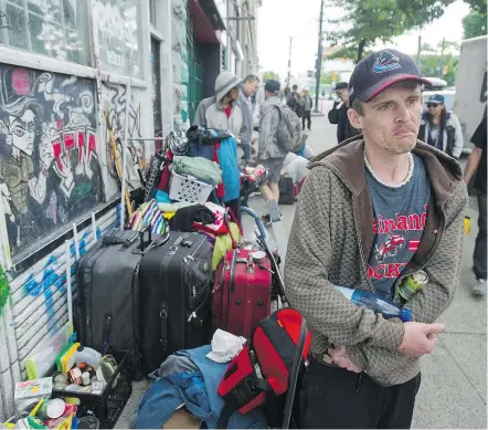  ??  ?? Residents pack their bags and leave the infamous Balmoral Hotel in the Downtown Eastside on Saturday. Resident Troy Sprague has not found a new place to live. JASON PAYNE/ PNG