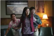  ?? ALLYSON RIGGS — A24FILMS VIA AP ?? From left, Stephanie Hsu, Michelle Yeoh and Ke Huy Quan in a scene from, “Everything Everywhere All At Once.”