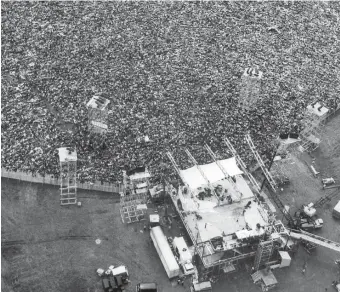  ?? AP FILE ?? FUN AND MUSIC: An aerial photo from Aug. 16, 1969, shows the jam-packed Woodstock Music &amp; Arts Festival in Bethel, N.Y.