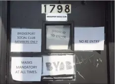  ?? Ned Gerard / Hearst Connecticu­t Media ?? Signs on the door to Keystone, a social club on Barnum Avenue in Bridgeport.