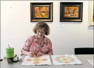  ?? The Sentinel-Record/Richard Rasmussen ?? CENTER CLOSING: Terrie Newman, of Hot Springs, works on a pencil on fabric design for a quilt she is making at the Fine Arts Center of Hot Springs on Thursday. The center announced Thursday it has lost its lease and will close its doors on Oct. 1.