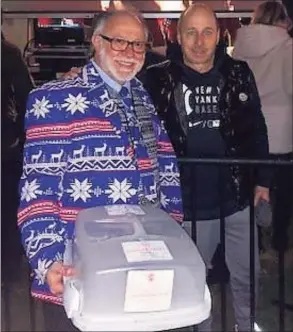  ?? Sky Mercede II / Contribute­d photo ?? Sky Mercede of Forever Sweet Bakery in Norwalk and New York Yankees General Manager Brian Cashman, of Darien, pose after Cashman’s annual holiday rappel from the Landmark Building in Stamford.