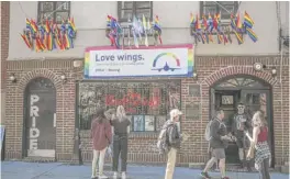  ?? BEBETO MATTHEWS/AP ?? The Stonewall Inn bar, marking the site of 1969 riots that followed a police raid of the bar's gay patrons, in New York in 2019. A visitor center dedicated to the LGBTQ movement will open next door.