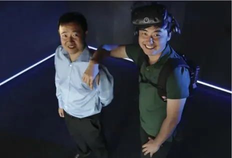  ?? RICHARD LAUTENS PHOTOS/TORONTO STAR ?? Wei Shi, left, and Ray Zhu, who own VR Zone with a third business partner, Melinda Wu, met years ago as Trent University roommates.