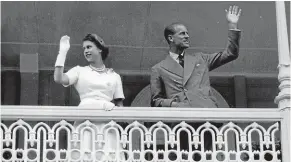  ?? PUKE ARIKI/NPDC ?? The Queen and Duke of Edinburgh wave from the balcony of the Criterion Hotel, New Plymouth, in 1954.