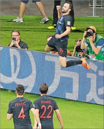  ?? MARK BAKER/AP PHOTO ?? Croatia’s Milan Badelj leaps to celebrate his goal during Tuesday’s 2-1- win over Iceland in the World Cup.