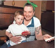  ?? RICK WOOD, MILWAUKEE JOURNAL SENTINEL ?? Chef Jodi Janisse-Kanzenbach, owner of Cafe Soeurette in West Bend, shown with her son Drake in 2016, advocates making fruit chutneys and butters to use all year at dinner.