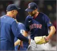  ?? AP photo ?? Red Sox pitcher Michael Wacha is greeted by manager Alex Cora after Boston beat the Los Angeles Angels 1-0 on Monday.
