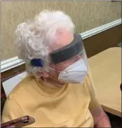  ??  ?? Eugenie Beall, a resident at Samaritas Senior Living of Bloomfield Hills, awaits her turn to receive the Pfizer vaccine on Wednesday.