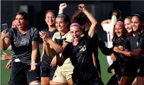  ?? COURTESY PHOTO ?? Delta's Brooklyn Gribaudo, center, celebrates a victory with her teammates.