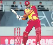  ??  ?? West Indies’ Kieron Pollard on way to his unbeaten 75 off 37 balls at the Eden Park in Auckland on Friday.