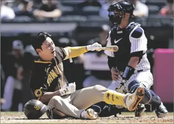  ?? AP PHOTO/ADAM HUNGER ?? San Diego Padres’ Ha-Seong Kim reacts after a pitch by the New York Yankees during the fourth inning of a baseball game on Sunday, in New York.