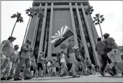  ?? ASSOCIATED PRESS ?? TEACHERS RALLY OUTSIDE OF GOV. DOUG DUCEY’S Executive Tower on Monday in Phoenix on their third day of walkouts.