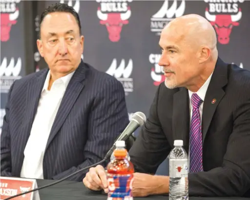  ?? JAMES FOSTER/ FOR THE SUN- TIMES ?? For Bulls execs Gar Forman ( left) and John Paxson, negotiatio­ns with restricted free agent Zach LaVine won’t be easy this summer.