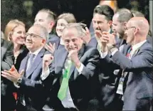  ?? Pavel Golovkin Associated Press ?? DELEGATES from the bid committee of the U.S., Canada and Mexico celebrate being awarded the 2026 World Cup in Moscow.